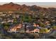 Panoramic aerial shot of a meticulously planned community featuring a park and picturesque mountain scenery at 19978 N 101St Pl, Scottsdale, AZ 85255