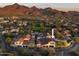 Aerial view of home showcasing mature landscaping, neighborhood and mountain views at 19978 N 101St Pl, Scottsdale, AZ 85255