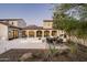 Beautiful backyard with outdoor kitchen, dining area, and pool with serene mountain views at 19978 N 101St Pl, Scottsdale, AZ 85255