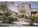 Well-maintained home featuring a stucco exterior, tile roof, and professionally landscaped front yard at 19978 N 101St Pl, Scottsdale, AZ 85255