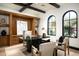 Inviting home office with custom wood built-ins, coffered ceiling, and abundant natural light at 19978 N 101St Pl, Scottsdale, AZ 85255