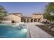 Luxury home featuring a gorgeous pool, travertine tile deck, outdoor kitchen and covered dining area at 19978 N 101St Pl, Scottsdale, AZ 85255