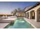 Gorgeous pool with water feature, travertine patio, and covered terrace, great for entertaining at 19978 N 101St Pl, Scottsdale, AZ 85255