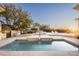 An oversized and luxurious swimming pool with in-pool loungers and views of the surrounding neighborhood at 19978 N 101St Pl, Scottsdale, AZ 85255