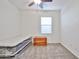 Bright bedroom featuring a window, new mattress, and wood accent trunk at 20231 W Grant St, Buckeye, AZ 85326