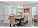 Inviting dining area with wood table, upholstered chairs, and decorative vase at 20231 W Grant St, Buckeye, AZ 85326