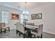 Inviting dining room with a modern table, upholstered chairs, and decorative accents at 20231 W Grant St, Buckeye, AZ 85326