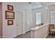 Bright entryway featuring white trim and doors, wood-look flooring, and decorative wall art at 20231 W Grant St, Buckeye, AZ 85326