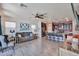 Inviting living room with hardwood floors, modern decor, and an open view of the kitchen at 20231 W Grant St, Buckeye, AZ 85326