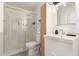 Modern bathroom features an enclosed shower, vanity, and sleek fixtures at 2032 E Harvard St, Phoenix, AZ 85006