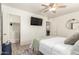 Bedroom featuring a ceiling fan and a wall-mounted television for easy viewing at 2032 E Harvard St, Phoenix, AZ 85006