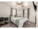 Cozy bedroom with wood floors, a ceiling fan, and two windows for plenty of natural light at 2032 E Harvard St, Phoenix, AZ 85006