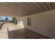 View of covered patio with painted brick wall and view to street at 2032 E Harvard St, Phoenix, AZ 85006