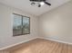 Bedroom showcasing wood flooring, window with blinds, and ceiling fan at 2150 E Bell Rd # 1176, Phoenix, AZ 85022