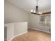 Dining Room featuring wood floors, modern lighting fixture, and a window allowing natural light at 2150 E Bell Rd # 1176, Phoenix, AZ 85022