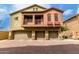 Two-story condo with a three-car garage and a brick driveway at 2150 E Bell Rd # 1176, Phoenix, AZ 85022