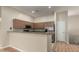 Well-equipped kitchen with stainless steel appliances and bar-style countertop at 2150 E Bell Rd # 1176, Phoenix, AZ 85022