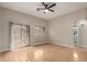 Inviting living room with hardwood floors, fan, and balcony access at 2150 E Bell Rd # 1176, Phoenix, AZ 85022