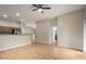 Open-concept living space with hardwood floors and modern lighting fixtures at 2150 E Bell Rd # 1176, Phoenix, AZ 85022