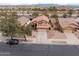 Aerial shot of a single-Gathering home showcasing desert landscaping, a tile roof, and an attached two-car garage at 22336 E Via Del Palo --, Queen Creek, AZ 85142