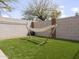 Backyard area featuring a hammock on artificial grass for relaxation and leisure at 22336 E Via Del Palo --, Queen Creek, AZ 85142