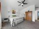 Bright bedroom featuring neutral colored carpet and decor, plus a ceiling fan at 22336 E Via Del Palo --, Queen Creek, AZ 85142