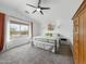 Spacious bedroom featuring a ceiling fan, and a large window with natural light at 22336 E Via Del Palo --, Queen Creek, AZ 85142