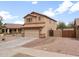 Well-maintained two-story home with a three-car garage and brick-paved driveway extension at 22336 E Via Del Palo --, Queen Creek, AZ 85142