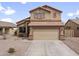 Charming two-story home featuring a spacious three-car garage and a well-maintained desert landscape at 22336 E Via Del Palo --, Queen Creek, AZ 85142