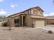 Attractive two-story home boasts a neutral color palette and low-maintenance desert landscaping at 22336 E Via Del Palo --, Queen Creek, AZ 85142