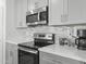 Close-up of a kitchen showcasing stainless steel appliances, including a microwave and oven at 22336 E Via Del Palo --, Queen Creek, AZ 85142