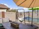 Backyard patio with a relaxing hammock and comfortable seating near the pool at 22336 E Via Del Palo --, Queen Creek, AZ 85142