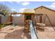 Backyard playground area with a wooden playset and a slide at 22336 E Via Del Palo --, Queen Creek, AZ 85142