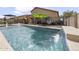 Inviting pool with waterfall feature and fenced patio at 22336 E Via Del Palo --, Queen Creek, AZ 85142