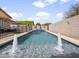 Backyard pool featuring water fountains, privacy wall, and desert landscaping at 22336 E Via Del Palo --, Queen Creek, AZ 85142