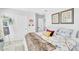 Brightly lit bedroom features a bed, colorful artwork adorning the walls and a carpeted floor at 22484 E Twilight Dr, Queen Creek, AZ 85142
