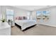 Neutral bedroom with plush carpet, recessed lighting, and large windows at 22484 E Twilight Dr, Queen Creek, AZ 85142