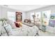 Brightly lit bedroom features large windows, a decorative bed, and colorful artwork adorning the walls at 22484 E Twilight Dr, Queen Creek, AZ 85142