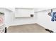 Walk-in closet with carpet flooring, white walls, shelf space, metal bars, and a small safe on the wall at 22484 E Twilight Dr, Queen Creek, AZ 85142
