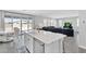 Open concept kitchen island with a stainless dishwasher that flows into a Gathering room at 22484 E Twilight Dr, Queen Creek, AZ 85142