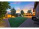 Backyard featuring artificial turf, desert landscaping, a pergola, and a hot tub at 24117 N 165Th Dr, Surprise, AZ 85387