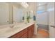 Bathroom featuring a double sink vanity and a shower/tub combo with a curtain at 24117 N 165Th Dr, Surprise, AZ 85387