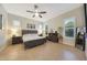 Relaxing main bedroom with neutral colors and ample natural light at 24117 N 165Th Dr, Surprise, AZ 85387