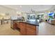 Modern kitchen island with granite countertops, stainless steel dishwasher, and open concept living space at 24117 N 165Th Dr, Surprise, AZ 85387