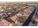 Aerial shot of the neighborhood showcasing well-maintained homes, tiled roofs, and convenient street access at 24117 N 165Th Dr, Surprise, AZ 85387