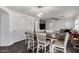 Open-concept dining area seamlessly connects to living room and kitchen, creating a harmonious living space at 2435 W Via Dona Rd, Phoenix, AZ 85085