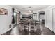 Open dining area with modern decor, sliding glass door and seamless flow into the kitchen and main living areas at 2435 W Via Dona Rd, Phoenix, AZ 85085