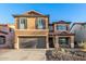 Inviting two-story house showcasing a large driveway and well-maintained, drought-tolerant front yard at 2435 W Via Dona Rd, Phoenix, AZ 85085