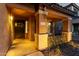 Covered front porch featuring stone pillars, decorative wreath, and clear address numbers at 2435 W Via Dona Rd, Phoenix, AZ 85085