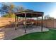 Outdoor gazebo with seating and dining area, perfect for entertaining guests at 2435 W Via Dona Rd, Phoenix, AZ 85085